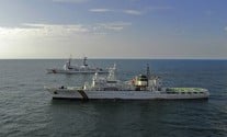 A Republic of Korea Coast Guard vessel alongside the U.S. Coast Guard cutter USCGC Boutwell. Photo: USCG/Wikimedia Commons