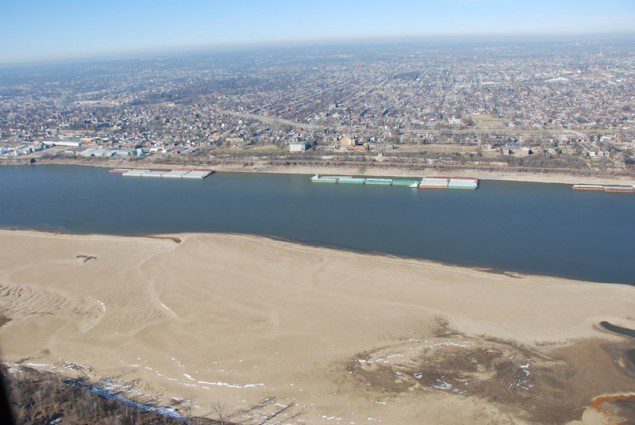 This season's flooding comes on the heels of historically low water levels this past winter. In this photo, A sandbar is exposed due to the low water situation on the Mississippi River near St. Louis Harbor, Jan. 8, 2013. (U.S. Coast Guard photo by Lt. j.g. Colby Buchanan.)