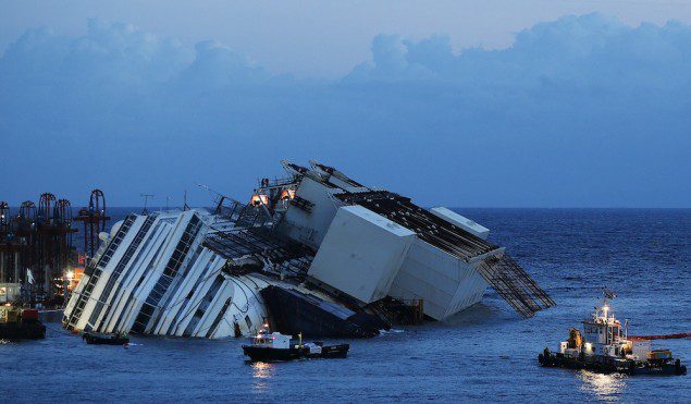 The capsized cruise liner Costa Concordia lies on its side next to Giglio Island