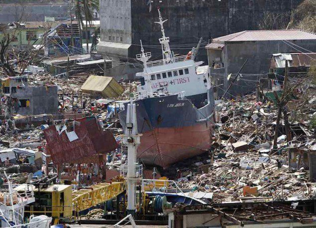 A cargo ship washed ashore is seen after super typhoon Haiyan hit Anibong town, Tacloban