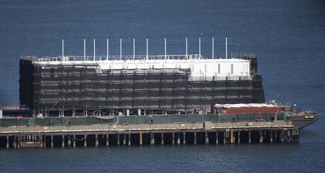 A barge built with four levels of shipping containers is seen at Pier 1 at Treasure Island in San Francisco, California October 28, 2013. REUTERS/Stephen Lam