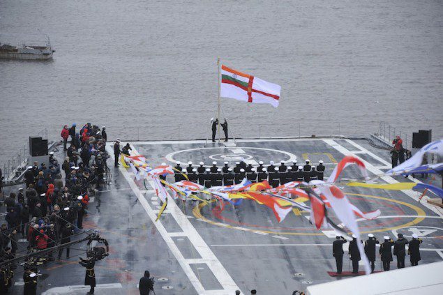 Indian Navy flag is hoisted on INS Vikramaditya as it is commissioned into Indian Navy, at Sevmash Shipyard in Russia