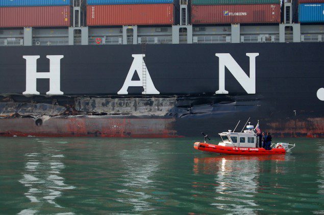 A U.S. Coast Guard boat inspects the 100-foot gash in the hull of the Cosco Busan, which resulted in the release of an estimated 53,000 gallons of oil. U.S. Coast Guard Photo