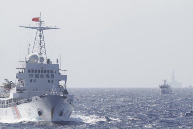 Chinese Coast Guard ships are seen near Chinese oil rig Haiyang Shi You 981 in the South China Sea, about 210 km (130 miles) off shore of Vietnam May 14, 2014. REUTERS/Nguyen Minh