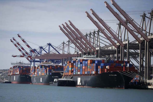 Container ships sit in berths at the Port of Los Angeles, California October 15, 2014 file photo. REUTERS/Lucy Nicholson