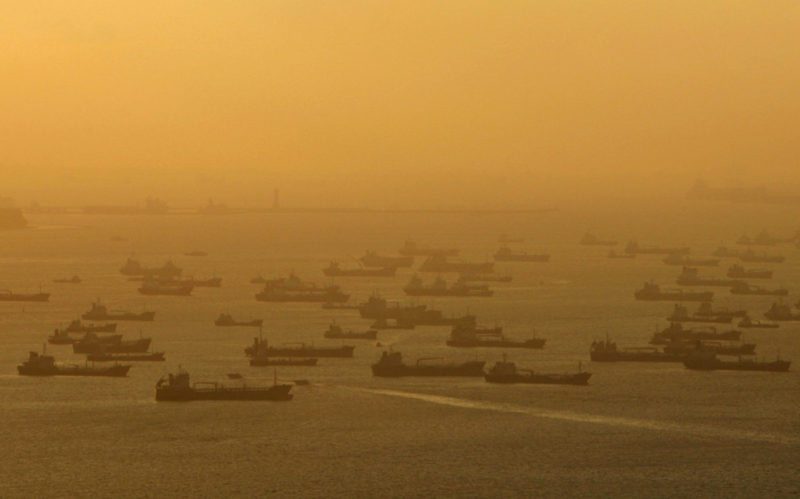 Shipping vessels and oil tankers line up on the eastern coast of Singapore in this July 22, 2015.  REUTERS/Edgar Su/Files