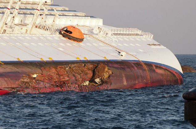 Rock embedded in the port side of the damaged hull of the Costa Concordia.
