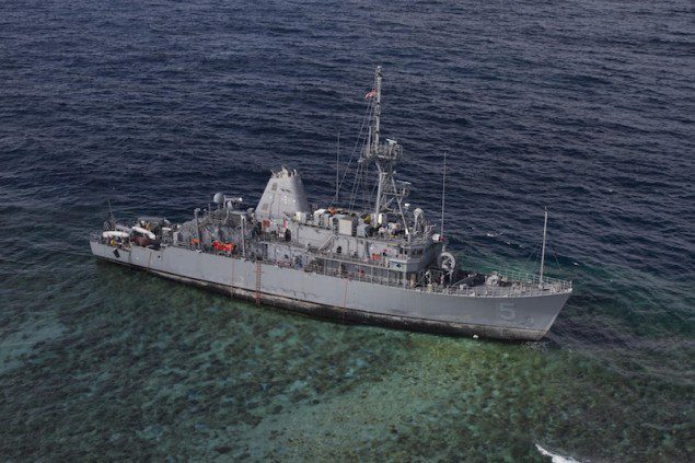 130122-N-ZZ999-061 TUBBATAHA REEF (Jan. 22, 2013) The mine countermeasures ship USS Guardian (MCM 5) sits aground on the Tubbataha Reef. (U.S. Navy photo by Naval Aircrewman (Tactical Helicopter) 3rd Class Geoffrey Trudell/Released)