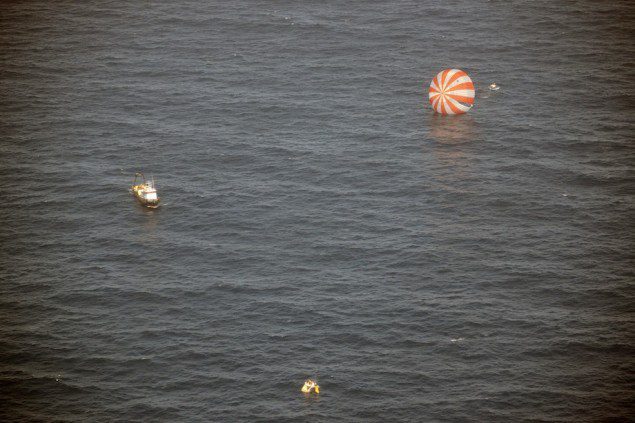 Recovery boats approach Dragon after splashdown into the Pacific Ocean. Photo: SpaceX