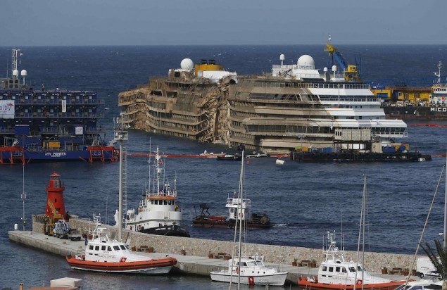 The capsized cruise liner Costa Concordia is seen at the end of the "parbuckling" operation outside Giglio harbour September 17, 2013. REUTERS/Tony Gentile