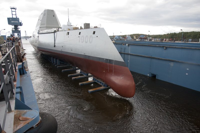he Zumwalt-class guided-missile destroyer DDG 1000 is floated out of dry dock at the General Dynamics Bath Iron Works shipyard in October 2013. U.S. Navy Photo