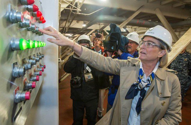  sponsor Susan Ford Bales initiated the flow of more than 100 million gallons of water into the dry dock with the touch of a dozen buttons. Photo by Chris Oxley, Newport News Shipbuilding