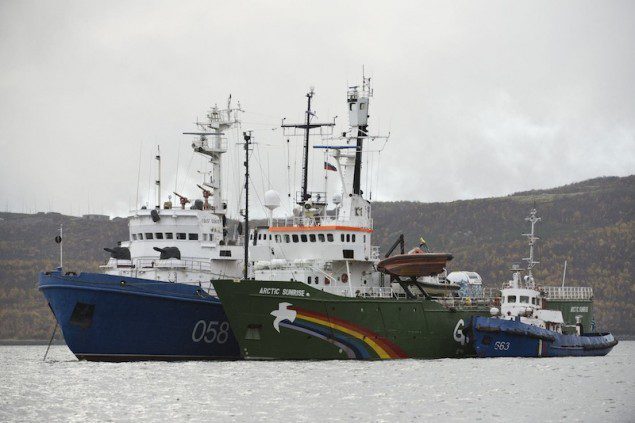 Greenpeace ship "Arctic Sunrise" (C) is seen anchored outside the Arctic port city of Murmansk, on the day when members of Russian Investigation Committee conducted an inspection onboard the Greenpeace ship, in this September 28, 2013 handout provided by Greenpeace. Mandatory Credit. REUTERS/Dmitri Sharomov/Greenpeace/Handout via Reuters