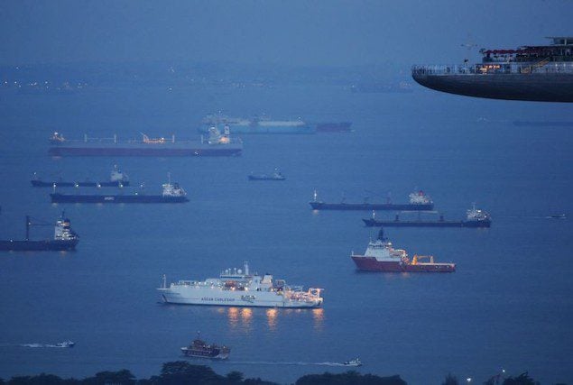 Ships at anchor near the Port of Singapore. Picture taken July 17, 2013. REUTERS/Edgar Su