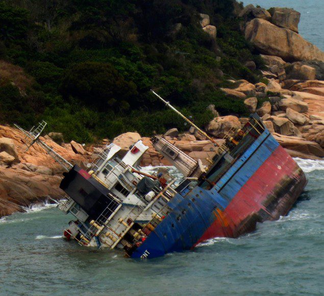 Cargo Ship On the Rocks Off Hong Kong [IMAGES]