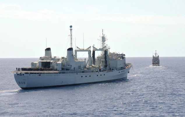 HMCS Protecteur under tow by the Military Sealift Command fleet ocean tug USNS Sioux (T-ATF 171). U.S. Navy Photo