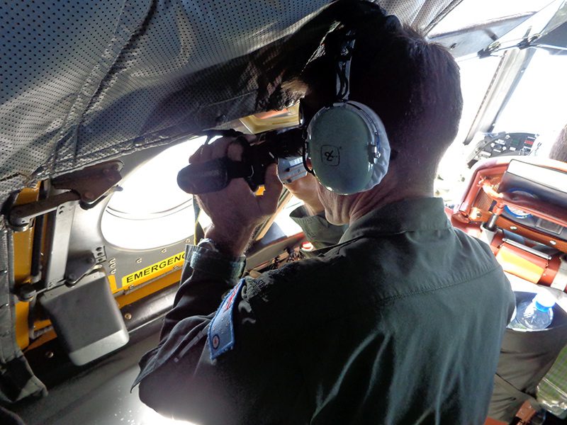 Sailors Looking Out Windows Trump Technology in Jet Search