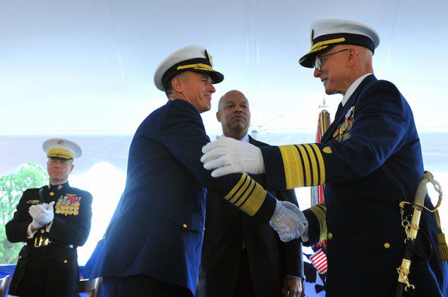 Department of Homeland Security Secretary Jeh Johnson (center) presides as Adm. Paul Zukunft (left) relieves Adm. Bob Papp during a change of command ceremony at Coast Guard Headquarters in Washington May 30, 2014. U.S. Coast Guard Photo