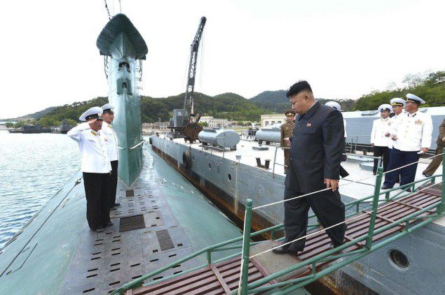 North Korean leader Kim Jong Un boards a submarine during his inspection of the KPA Naval Unit 167