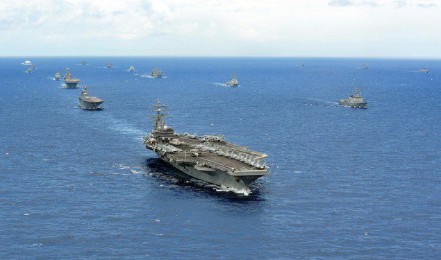 (July 25, 2014) The aircraft carrier USS Ronald Reagan (CVN 76) leads a close formation of 42 ships and submarines from 15 international partnership nations during Rim of the Pacific (RIMPAC) 2014. (U.S. Navy photo by Mass Communication Specialist 1st Class Dustin Kelling/Released)