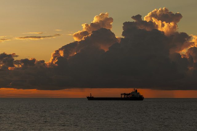 cargo ship sunset shipping bulk carrier