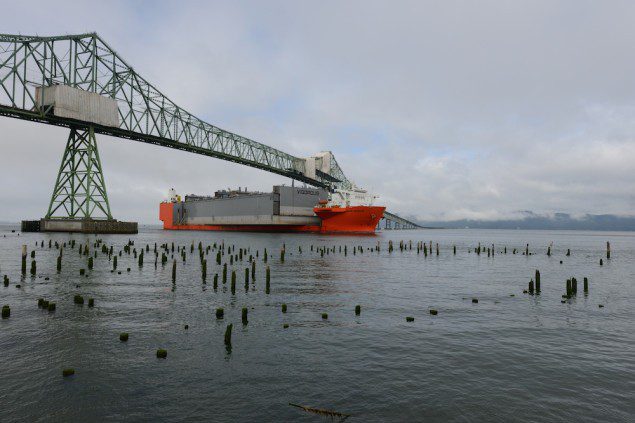 The heavy lift vessel Blue Marlin passes under the Astoria-Megler Bridge on its transit to deliver a dry dock to Portland, Ore., Aug. 24, 2014. U.S. Coast Guard Photos