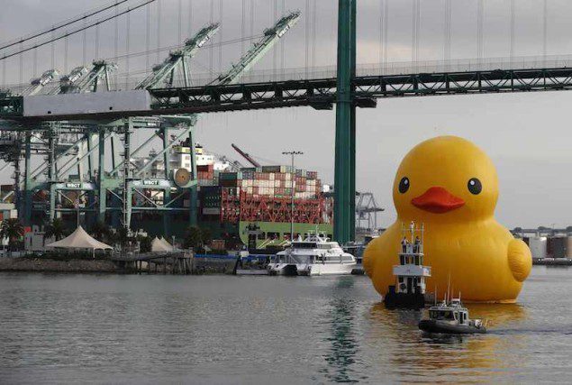 Giant inflatable rubber duck installation by Dutch artist Florentijn Hofman floats through the Port of Los Angeles as part of the Tall Ships Festival, in San Pedro