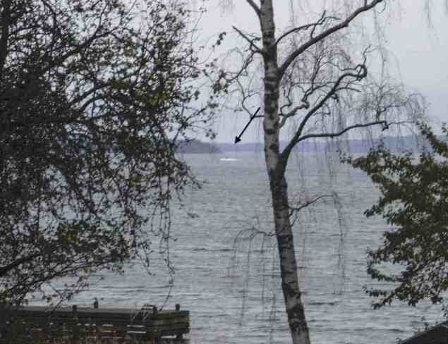 This amateur photo made available on October 19, 2014 by the Swedish Defence Ministry shows an object (top C) in the sea near Stockholm. Sweden released the grainy photo of a mysterious vessel in Stockholm's archipelago. REUTERS/Swedish Defence Ministry/Handout/TT News Agency