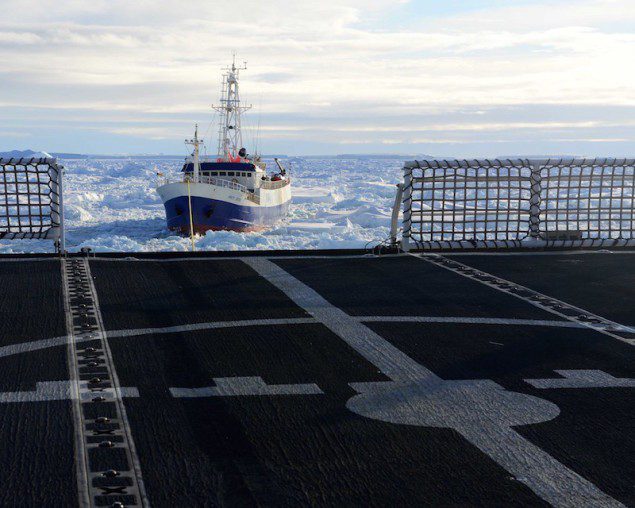 The disabled fishing vessel Antarctic Chieftain is towed astern of the Coast Guard Cutter Polar Star through sea ice near Antarctica, Feb. 14, 2015. U.S. Coast Guard Photo