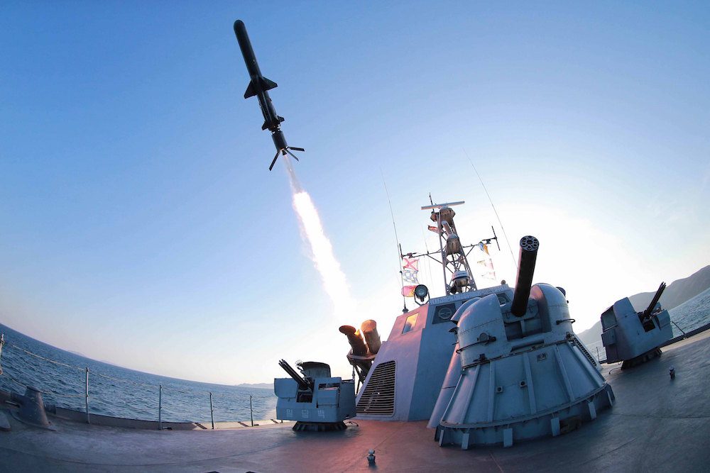 A missile is fired from a naval vessel during the test-firing of a new type of anti-ship cruise missile to be equipped at Korean People's Army (KPA) naval units in this undated photo released by North Korea's Korean Central News Agency (KCNA) in Pyongyang