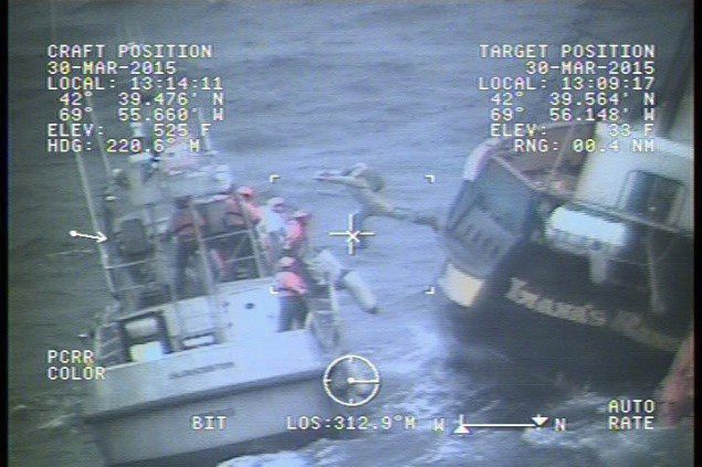 A crewmember leaps from the Canadian Tall Ship Liana's Ransom 58 miles east of Gloucester, Monday, March 30, 2015. Photo: U.S. Coast Guard