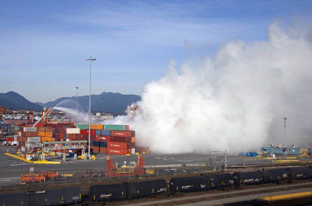 Smoke from a fire rises at the Port Metro Vancouver March 4, 2015. REUTERS/Ben Nelms