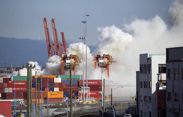 Smoke from a fire rises at the Port Metro Vancouver, British Columbia March 4, 2015. REUTERS/Ben Nelms