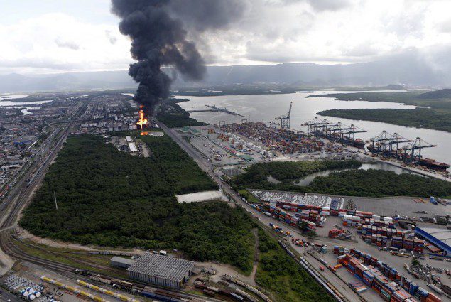 Smoke rises from a fire at a fuel tank storage facility run by Ultracargo in Santos near Sao Paulo April 2, 2015. Eighty firefighters were battling a fire at a fuel tank storage facility run by Ultracargo near Brazil's port of Santos, Latin America's largest, April 2, 2015. REUTERS/Paulo Whitaker