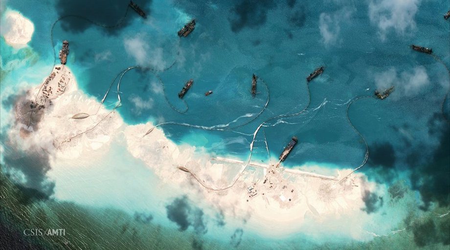 Satellite image of dredgers depositing sand on the northern rim of the Mischief Reef