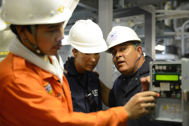 Tim Wilcox and Petty Officer 2nd Class Cindy Washburn, port state control officers at Coast Guard Sector Honolulu Prevention, conduct an inspection of the engine room aboard the 600-foot Panamanian-flagged bulk freight ship Teizan, at Kalaeloa Barbers Point Harbor, May 19, 2015. Coast Guard crew members conduct inspections to ensure a vessel has a suitable structure, correct documentation, proper working equipment and lifesaving equipment, and adequate accommodations. (U.S. Coast Guard photo by Petty Officer 2nd Class Tara Molle)