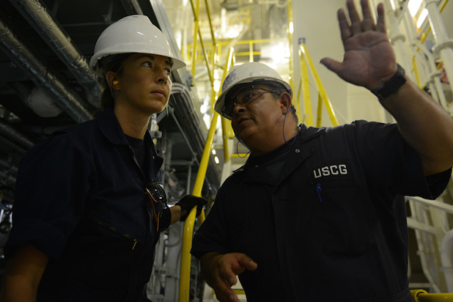 Tim Wilcox and Petty Officer 2nd Class Cindy Washburn, port state control officers at Coast Guard Sector Honolulu Prevention, conduct an inspection of the engine room aboard the 600-foot Panamanian-flagged bulk freight ship Teizan, at Kalaeloa Barbers Point Harbor, May 19, 2015. Coast Guard crewmembers conduct inspections to ensure a vessel has a suitable structure, correct documentation, proper working equipment and lifesaving equipment, and adequate accommodations. (U.S. Coast Guard photo by Petty Officer 2nd Class Tara Molle)