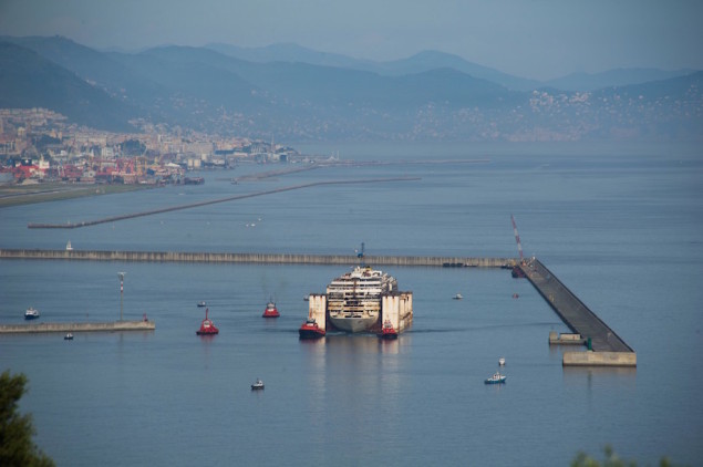 Costa Concordia is maneauvered away from the breakwater at Prà Voltri on Monday, May 11, 2015.