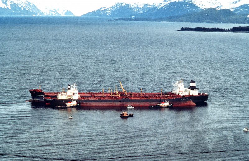 The Exxon Valdez sits in place in Prince Williams Sound after running aground. The Exxon Valdez ran aground on Bligh Reef in Prince William Sound, Alaska, March 23, 1989 spilling 11 million gallons of crude oil, which resulted in the largest oil spill in U.S. history. U.S. Coast Guard Photo