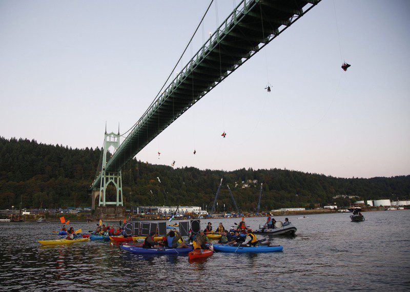 Activists suspend themselves from Portland's St. Johns Bridge in an attempt to block Shell's icebreaker from returning to Alaska. Photo: Greenpeace