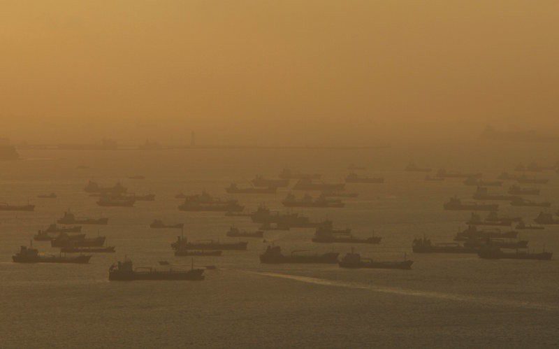Shipping vessels and oil tankers line up the eastern coast of Singapore in this July 22, 2015 file photo. REUTERS/Edgar Su