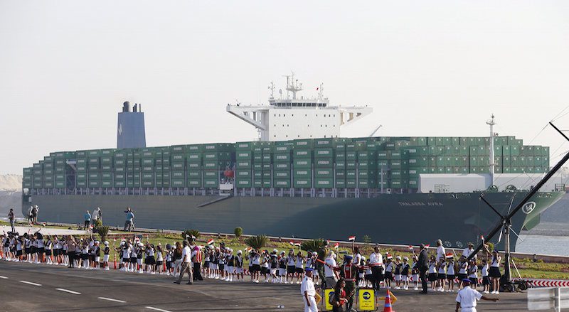 A cargo container ship crosses new section of Suez Canal after opening ceremony of new Suez Canal, in Ismailia