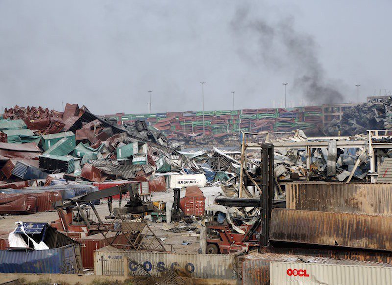 Smoke is seen near the site of last week's explosions at Binhai new district in Tianjin, China, August 17, 2015. REUTERS/Kim Kyung-Hoon