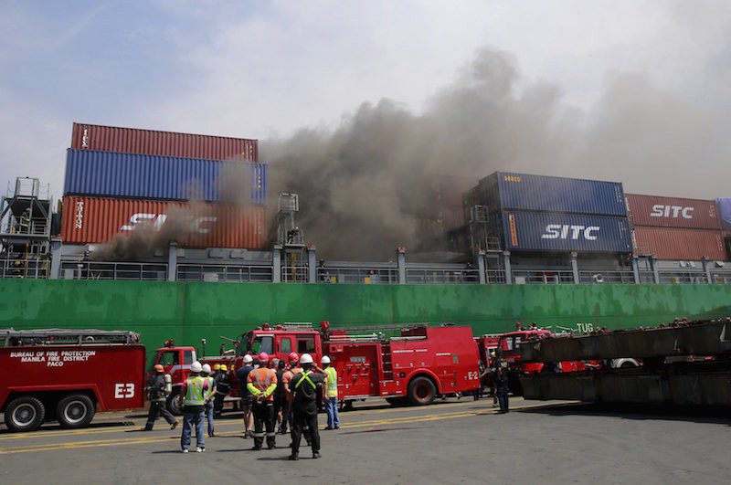 Smoke billows from the M/V Cape Moreton cargo ship after it caught fire while anchored at the Manila International Container Terminal (MICT) on September 12, 2015. Authorities have yet to determine the cause of the fire, local media reported. REUTERS/Romeo Ranoco