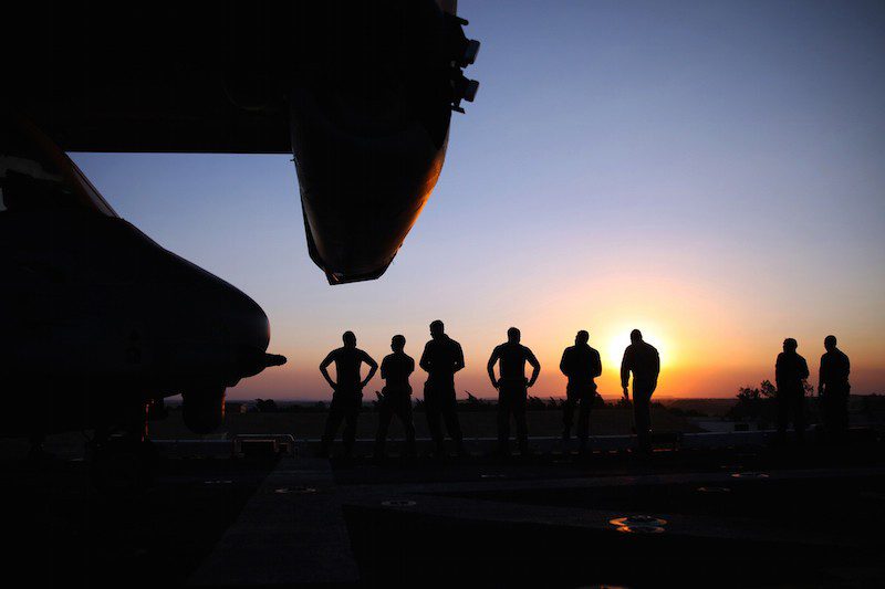 150621-M-QZ288-113 SUEZ CANAL, Egypt (June 21, 2015) Marines with the 24th Marine Expeditionary Unit (24th MEU) watch the sunset as the amphibious assault ship USS Iwo Jima (LHD 7) transits through the Suez Canal. The 24th MEU and Iwo Jima Amphibious Ready Group (ARG) transit the canal, a 120-mile long waterway connecting the Red Sea to the Mediterranean, and entered the U.S. 6th Fleet area of operations. The 24th MEU is deployed on the ships of the Iwo Jima ARG in support of U.S. national security interests in the U.S. 6th Fleet area of operations. (U.S. Marine Corps photo by Lance Cpl. Austin A. Lewis/Released)