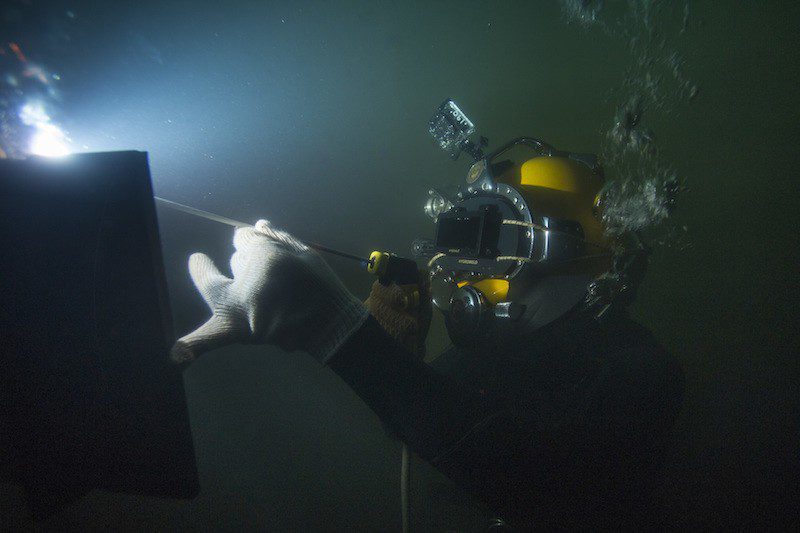 150714-N-WB378-199 MIAMI (July 14, 2015) Steel Worker 1st Class Jesse Hamblin, assigned to Underwater Construction Team (UCT) 2, makes a vertical fillet weld on a half inch steel plate. Members of UCT-2 are attending a 10-day underwater welding course provided by Hydroweld, in order to develop techniques required to weld in accordance with the American Welding Society, wet welding standards. (U.S. Navy photo by Mass Communication Specialist 1st Class Blake Midnight/Released)
