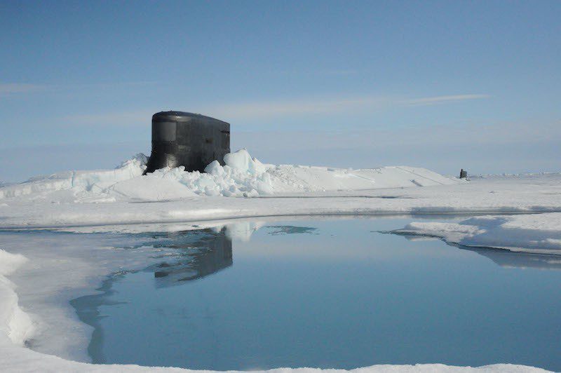 150730-N-ZZ999-003 ARCTIC OCEAN (July 30, 2015) The fast attack submarine USS Seawolf (SSN 21) surfaces through Arctic ice at the North Pole. Seawolf conducted routine Arctic operations. (U.S. Navy photo/Released)