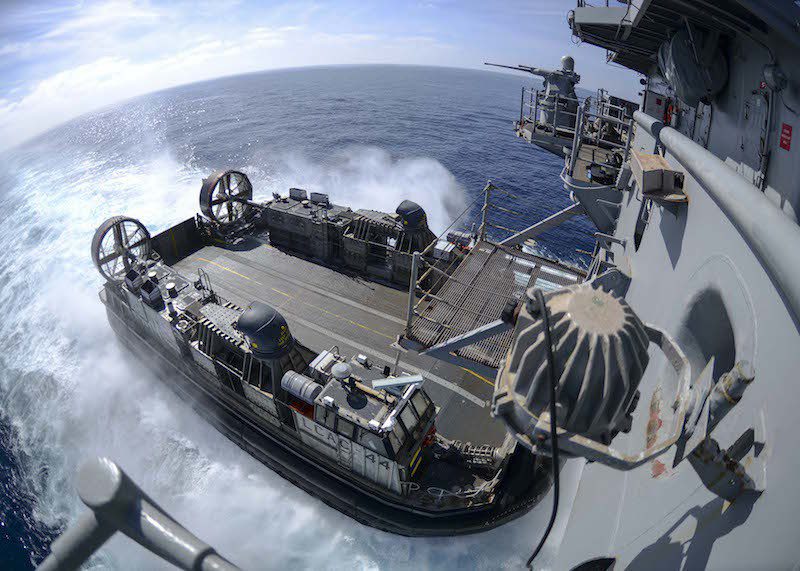 150928-N-GZ228-152 PACIFIC OCEAN (Sept. 28, 2015) Landing Craft Air Cushion (LCAC) 44, assigned to Assault Craft Unit (ACU) 5, approaches the well deck of the amphibious assault ship USS Boxer (LHD 4) during well deck operations. Boxer is underway off the coast of Southern California conducting routine training exercises and maintenance in preparation for its upcoming deployment. (U.S. Navy photo by Mass Communication Specialist 3rd Class Jesse Monford/Released)