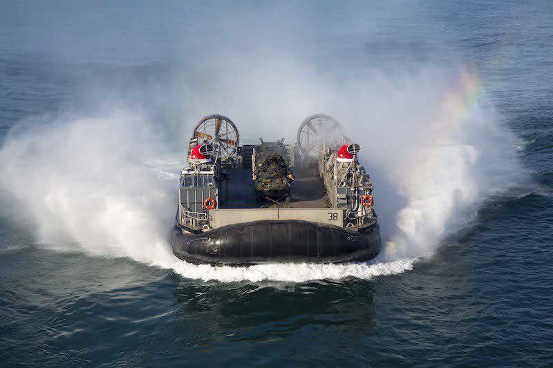 151008-N-KW492-016 ATLANTIC OCEAN (Oct. 8, 2015) A landing craft air cushion (LCAC) approaches the amphibious assault ship USS Kearsarge (LHD 3). Kearsarge is deployed as part of the Kearsarge Amphibious Ready Group to the U.S. 5th and 6th Fleet area of operations as part of a regularly scheduled deployment. (U.S. Navy photo by Mass Communication Specialist Seaman Apprentice Ryre Arciaga/Released)