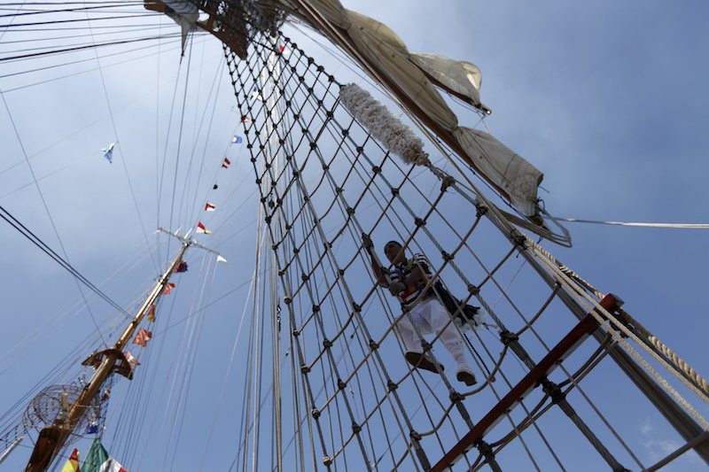 A sailor climbs up the mast of Mexico's naval training ship ARM Cuauhtemoc after its arrival in Puerto Quetzal, Guatemala
